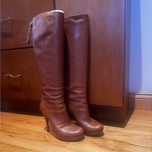 Gucci tan leather high heeled dress boots.